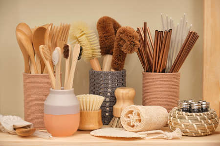 Collection of ecological household goods. Bamboo spoons, forks and toothbrushes. Eco-friendly...