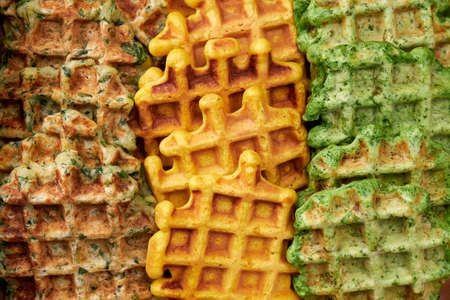 Potato, spinach and pumpkin vegan viennese waffles for breakfast, snack or dinner. Macro photography. View from above.の写真素材