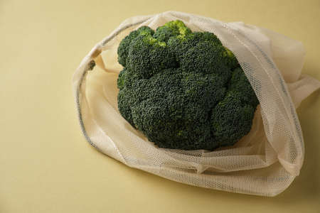 Fresh broccoli in a reusable fabric eco bag. Reusable eco-friendly products. Zero waste and sustainable plastic free lifestyle.の写真素材