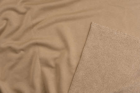 Background from beige monochrome cotton fabric. Close up texture of the fabric is useful as a background.の写真素材