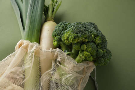 Fresh vegetables and fruits in a reusable fabric eco bag. Reusable eco-friendly products. Zero waste and sustainable plastic free lifestyle. View from above.の写真素材