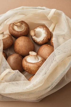 Fresh champignon in a reusable fabric eco bag. Reusable eco-friendly products. Zero waste and sustainable plastic free lifestyle. View from above.の写真素材