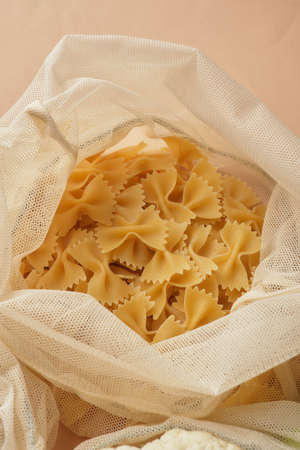 Chickpeas and pasta in a reusable fabric eco bag. Reusable eco-friendly products. Zero waste and...