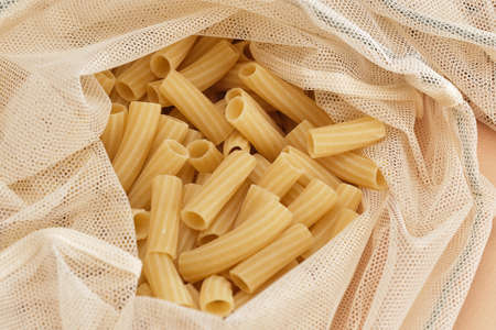 Chickpeas and pasta in a reusable fabric eco bag. Reusable eco-friendly products. Zero waste and sustainable plastic free lifestyle. View from above.の写真素材