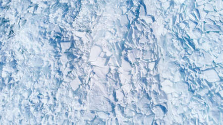 Texture of beautiful white broken ice of Lake Baikal, Siberia, Russia. View from above.