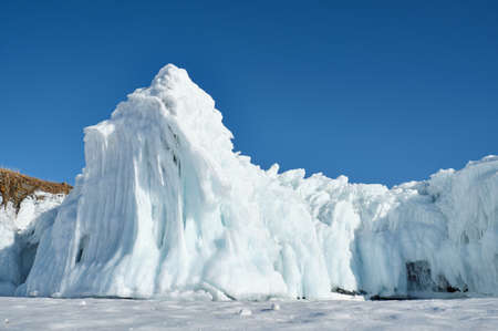 Frozen splash water on Baikal lake. Abstract winter background. Amazing scenery with frozen water....