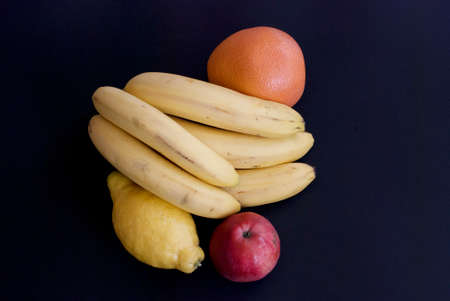 apple, bananas, grapefruit and lemonの写真素材