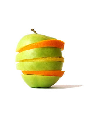 Fresh tasty colorful closeup orange, apple and lemon in a white backgroundの写真素材