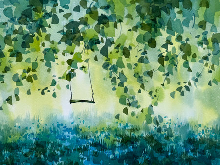Garden swing under the linden tree branchesの写真素材