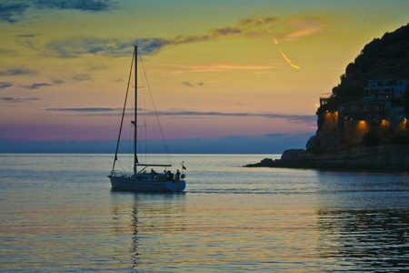 a yacht in colorful sunsetの写真素材