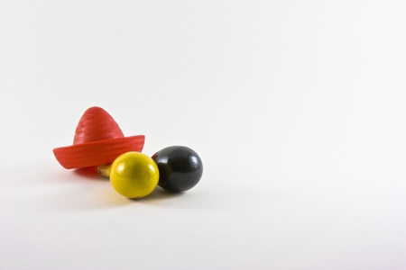 a red cowboy hat and two pins