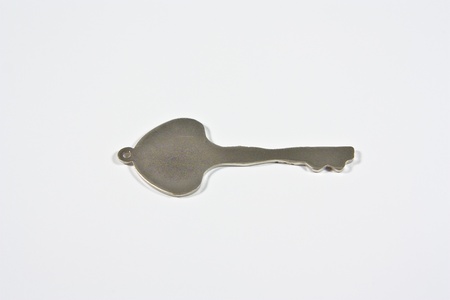 a metal locked heart with keyの写真素材