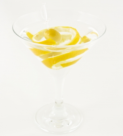 martini with olive and lemon in special martini glass  isolated on white background の写真素材
