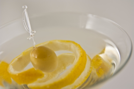 close-up view of martini with olive and lemon in special martini glass  shallow dept of field の写真素材