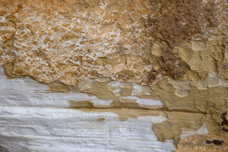 Patterns and textures of a rock wall with holes