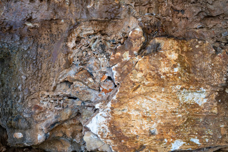 Patterns and textures of a rock wall with holes