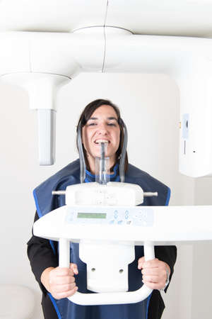 A patient in a dentist office having a panoramic dental radiography.の写真素材