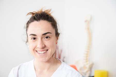 Portrait of a smiling young female physiotherapist.の写真素材