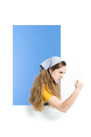 Angry housekeeper woman threatening high fistの写真素材