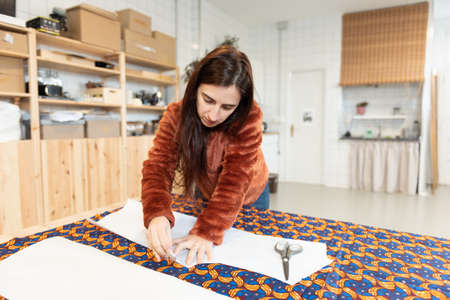 Dressmaker working with patterns