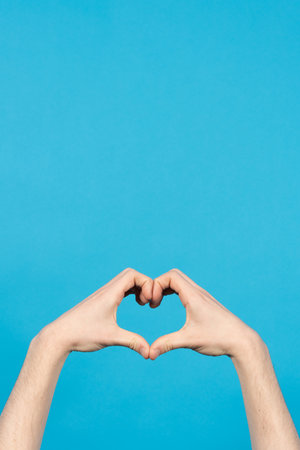Hands making heart or love sign with copy space.の写真素材