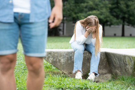 Sad girl crying alone after breakupの写真素材