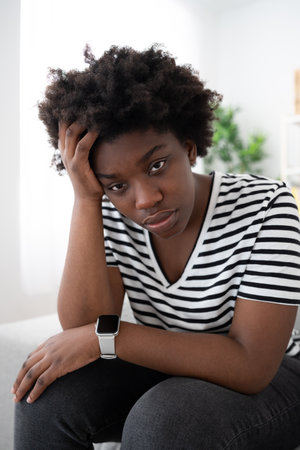 Sad African American woman looking at camera. Depression concept.の写真素材