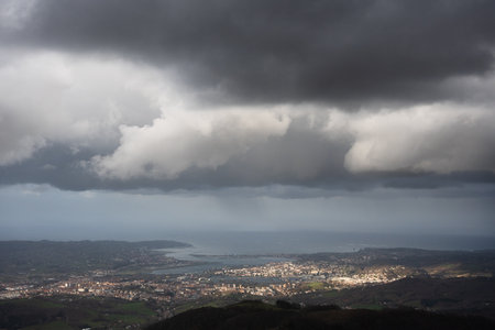 Dramatic landscape with copy space in the sky of the border between Spain and France in the Basque...