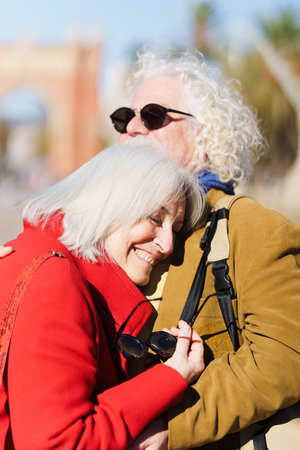 Closeup of romantic senior couple embracing outdoors.の写真素材
