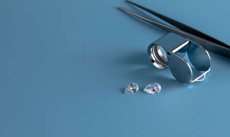 Close up of polished diamonds of different shapes and sizes on table with a magnifying glass on blue background top view with copy space. High quality photoの写真素材