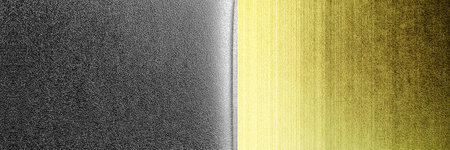 Panoramic texture of a black and yellow metallic background with some fine grain in itの写真素材