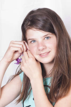 Pretty girl with orchid earringの写真素材