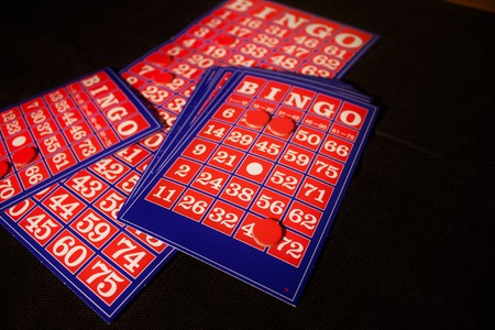 Playing  Bingo card on a black backgroundの写真素材