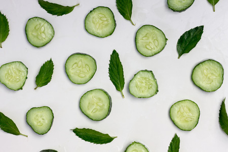 fresh mint leaves, cucumber and ice background.