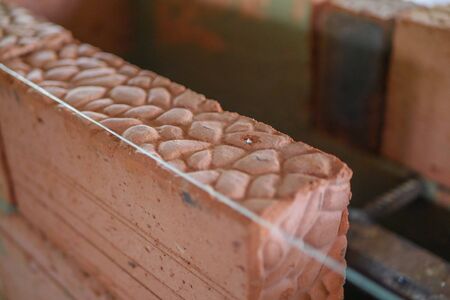 Trowel with a solution in a bucket. builder builds a brick stove, builder tools.