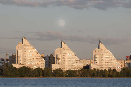 three high houses and big full moonの写真素材