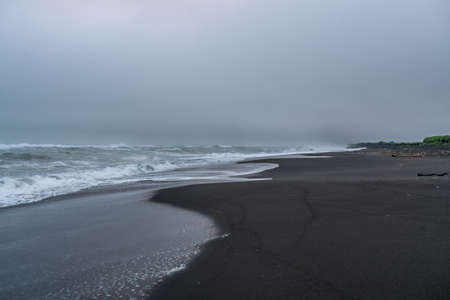 Black volcanic sand at Khalaktyrsky beach of the Pacific at Kamchatka peninsula, near Petropavlovsk-Kamchatsky, Russiaの写真素材