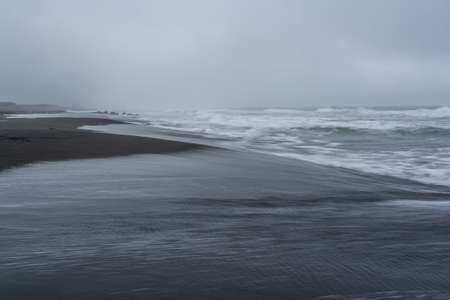 Majestic seacoast with wavy sea and cliffs.の写真素材