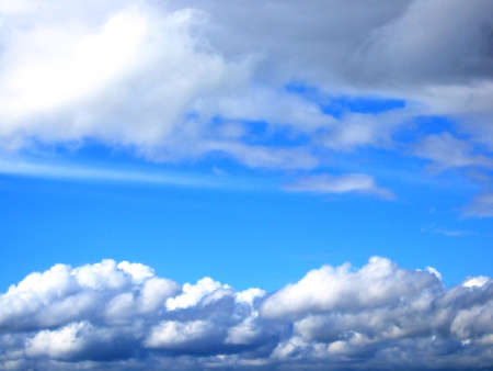 Photo of gloomy clouds on a background of the blue sky.