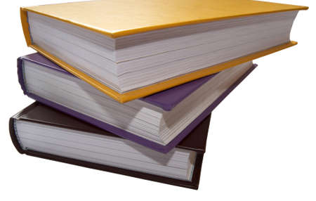 Close up three multi-coloured books on a white.の写真素材