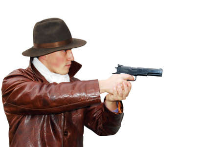 Dangerous looking mafia type with revolver.の写真素材