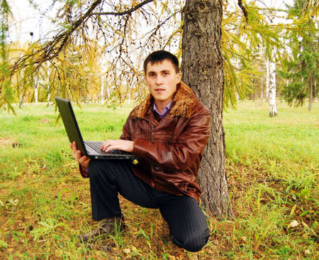 Man working with laptop outdoor.の写真素材