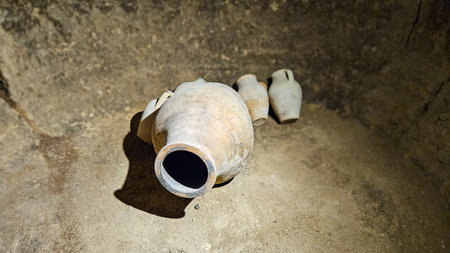 Ceramic pottery vase stands inside Cappadocia cave museum highlighting ancient history and cultural...