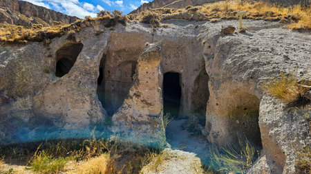 Cave in Cappadocia Turkey with archaeological artifacts and cultural museum exhibits preserved inside stone wallsの写真素材