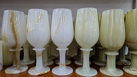 Elegant handmade decorative vases, goblets, and clocks made of natural marble and onyxの写真素材