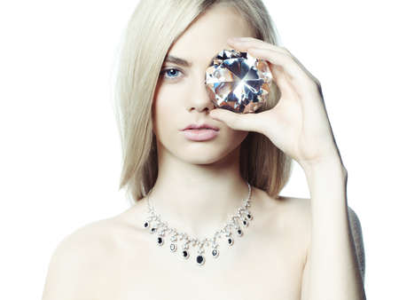 Studio fashion portrait of young beautiful lady in jewelry Studio fashion portrait of young beautiful lady in jewelry
