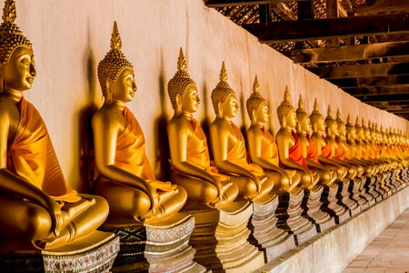 ancient ancient Buddha statues in the ancient Thai capital of Ayutthaya in the temple ruinsのeditorial素材