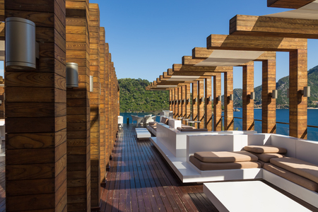 beautiful interior terrace overlooking the blue sea and the mountain with pinesのeditorial素材