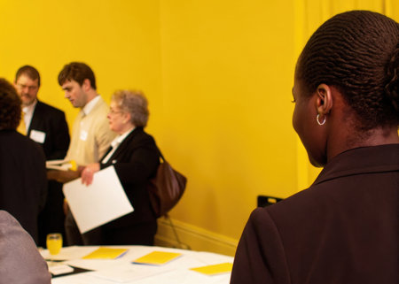Confident african american businesswoman looking at her colleagues during a meetingの素材