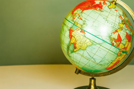 Globe on the table with a green background. Travel concept.の素材